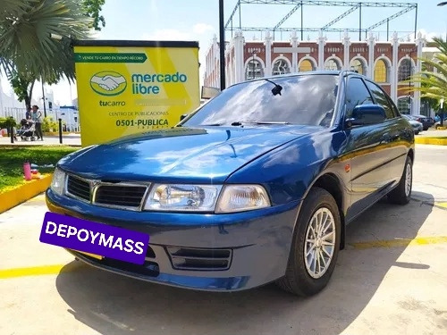 Cocuyo Guardafango Mitsubishi Signo Lancer Cruces  Foto 6