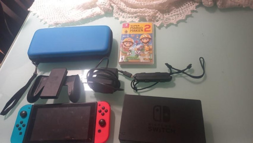 Nintendo Switch + Juego, Accesorios Originales.