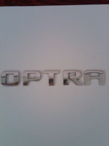 Emblema  Palabra Optra Chevrolet  En Metal Pulido Foto 5