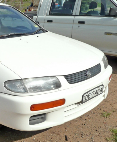 Cocuyos Parachoque Mazda 323 94/96 Nuevos Originales Koito  Foto 7