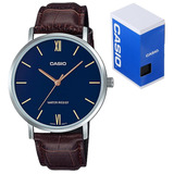 Reloj De Pulsera Casio Dress Mtp-vt01 De Cuerpo Color Plateado, Analógico, Para Hombre, Fondo Azul, Con Correa De Cuero Color Marrón, Agujas Color Dorado, Dial Dorado, Bisel Color Plateado Y Hebilla S