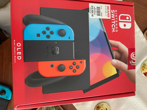 Nintendo Switch Oled.      +2controles+2juegos+estuche