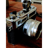 Camera Fotográfica + Manual 1970= Olympus Nikon Cannon Leica
