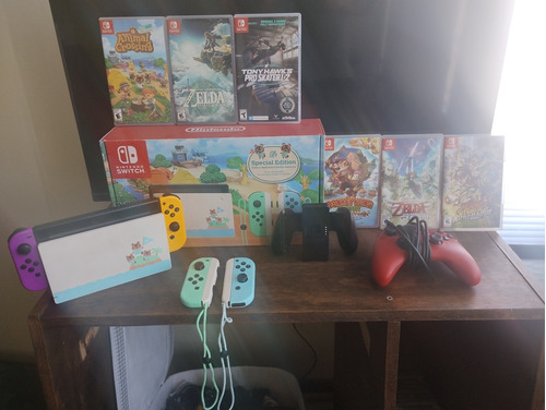 Nintendo Switch V2 Animal Crossings Ed. + 6 Juegos + 4 Joy