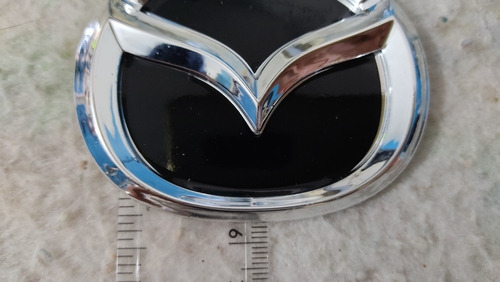 Emblema Logo Insignia Delantero Parrilla Mazda 323 Foto 6