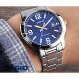 Reloj Pulsera Casio Mtp-v004 Con Correa De Acero Inoxidable Color Plateado - Fondo Azul