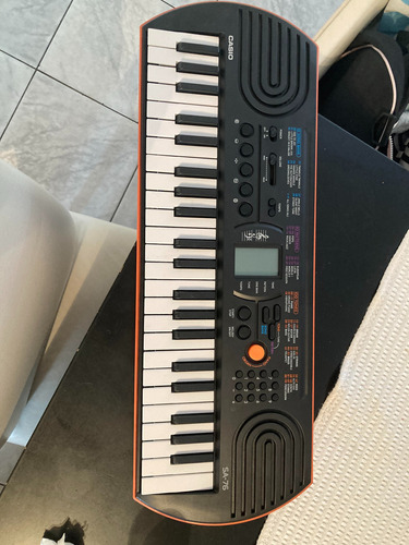 Teclado Musical Casio Mini Sa-76 44 Teclas Negro/naranja