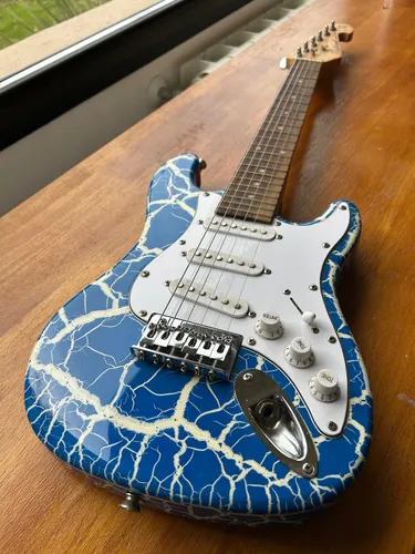 Primera imagen para búsqueda de guitarra madera nino