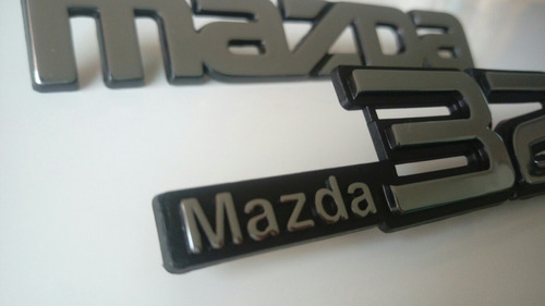 Emblemas  Mazda 323  Foto 4