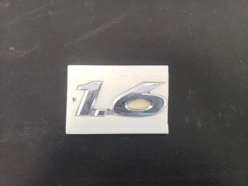 Emblema 1.6 Tampa Traseira Hb20 13/15 863271s000 Hy2805  - Hyundai - Código 8086