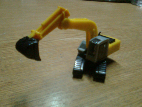 Kinder Sorpresa - Huevo Mediano - Escavadora - New Holland (Usado)