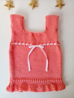 Ropa de bebe tejida a maquina sale