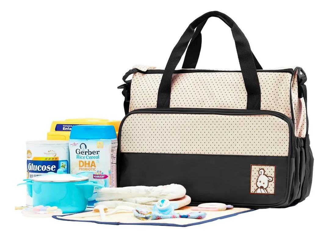 Interior con múltiples compartimentos organizadores Interior del bolso maternal con múltiples bolsillos organizadores para pañales y accesorios