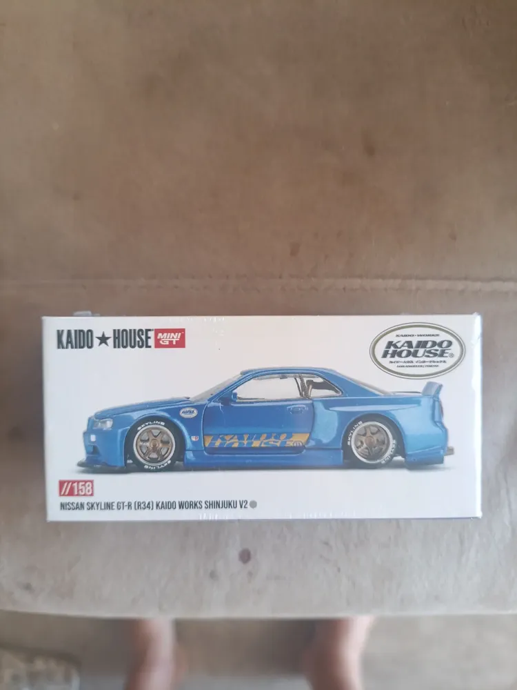 Miniatura Nissan Skyline GT-R R34 da Kaido House e Mini GT, Azul