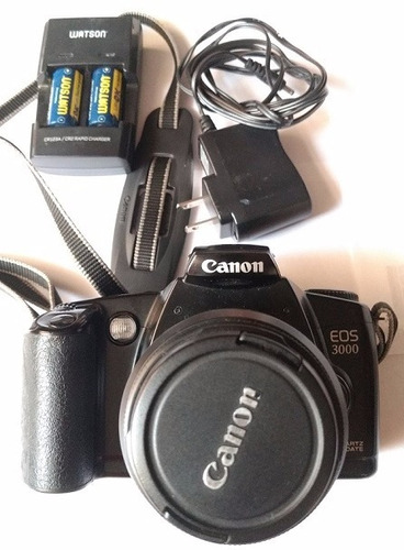Cámara Analógic Canon Eos 3000 Con Cargador De Pilas Cr123a