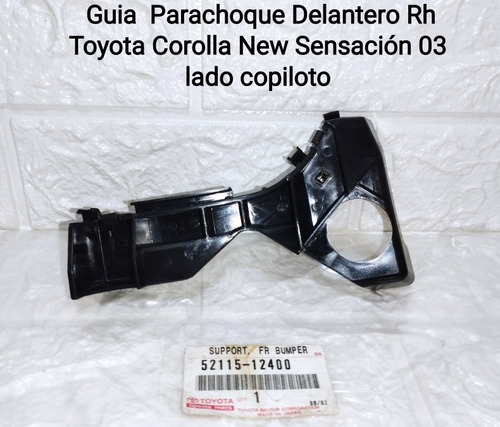 Soporte Guía Parachoque Delan Rh  Toyota Corolla 52115-12400