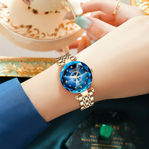 Reloj pulsera Seno S042 con correa de acero inoxidable fondo azul