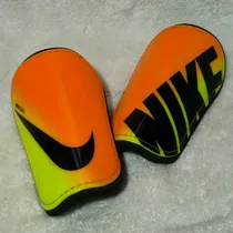 Comprar Caneleira Nike Mercurial Hardshell Slip-in Laranjaamarela M