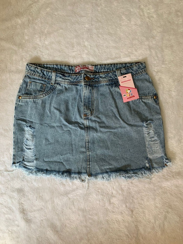 Imagem 1 de 2 de Saia Jeans Feminina Plus Size Desfiada E Curta
