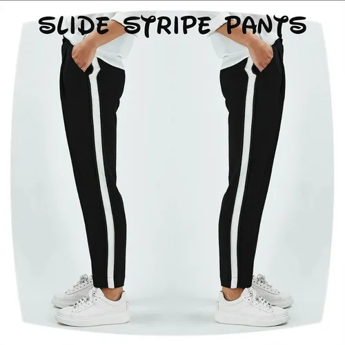 Pantalon negro con online raya blanca al costado