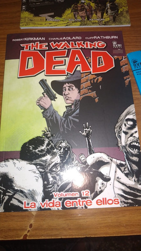 14 Comics Walking Dead + Libro, De Ovni Press. Canje/venta 