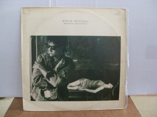 Lp Paul Young - Between Two Fires