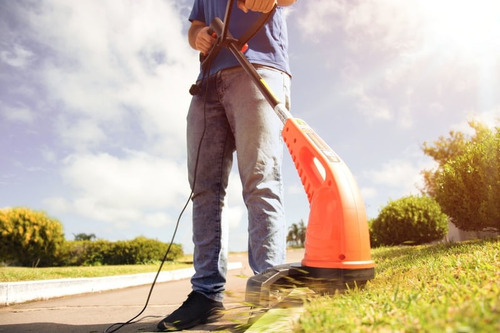 Bordeadora Tramontina AP1000T color naranja y negro 220V