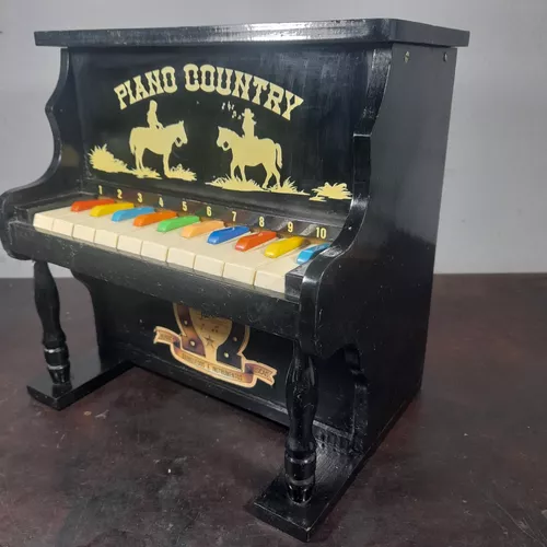 Antigo piano infantil de HERING decorado com pássaros p