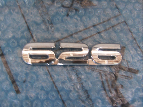 Emblema Compuerta Mazda626 