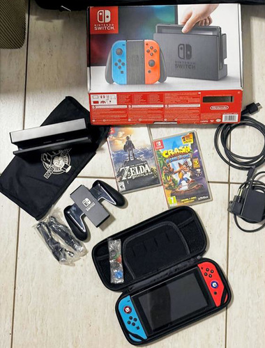 Console Nintendo Switch V1 32gb + 2 Jogos Originais + Mochila Case Película Acessórios Completos Azul-vermelho