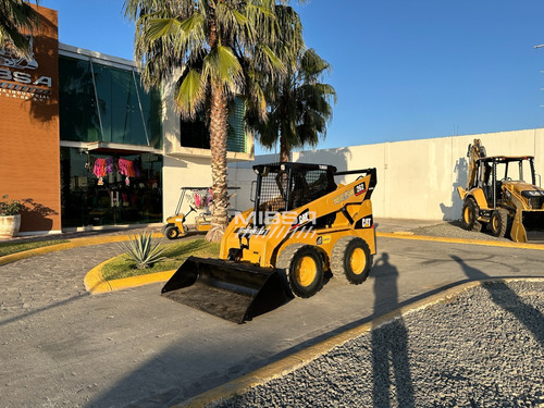 Minicargador Caterpillar/bobcat