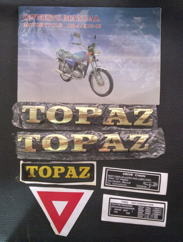 Emblema Ax 100 Topaz