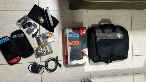 Console Nintendo Switch V1 32gb + 2 Jogos Originais + Mochila Case Película Acessórios Completos Azul-vermelho