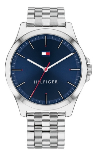 Reloj pulsera Tommy Hilfiger 1791713 con correa de acero inoxidable color plateado - fondo azul