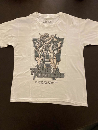 Remera Transformers Universal Studios Cambia De Color Al Sol