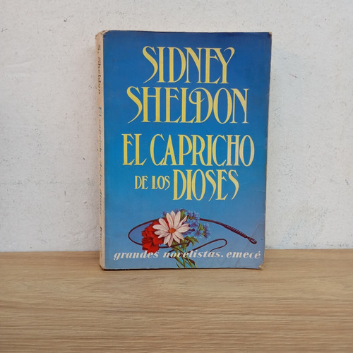 El Capricho De Los Dioses. Sidney Sheldon. Emecé (Usado)