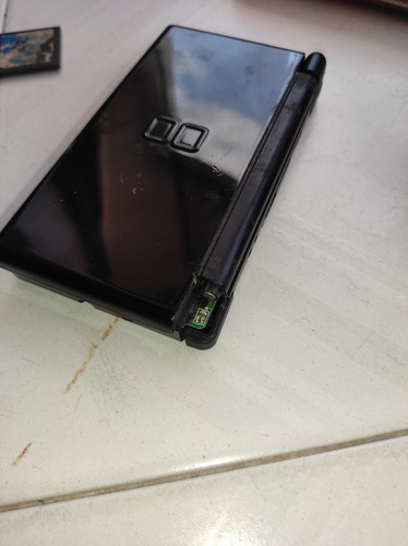 Nintendo 3ds Lite Para Reparar O Repuesto Cargador Y Forro (Usado)
