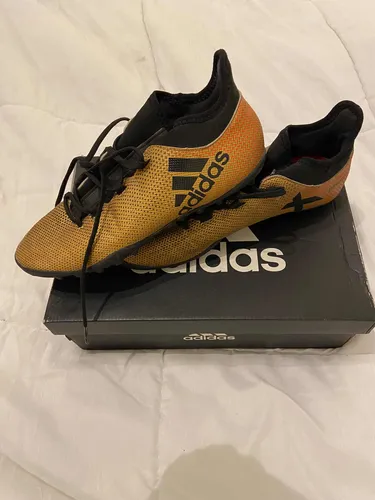 Botines adidas dorados clearance