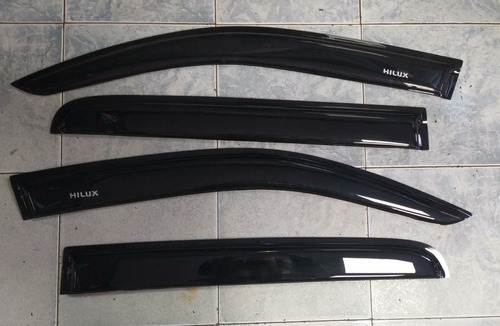 Acrilicos Ventanilla Negros Toyota Hilux Vigo 05-15 Con Logo