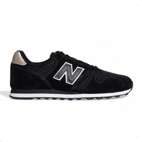 Zapatillas New Balance 373 negro dorado de mujer.