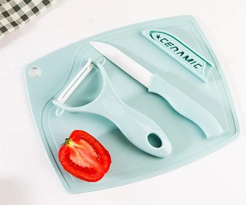 Cuchillo Y Pelador De Fruta Con Tabla De Picar