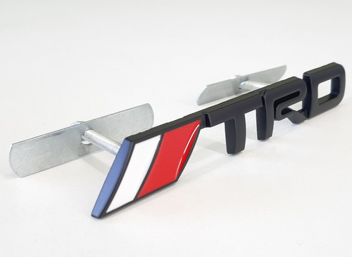 Imagem 2 de 4 de Emblema Trd Toyota Hilux Grade Dianteira Sw4 Srv Com Suporte