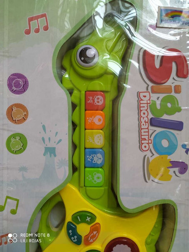 Imagen 2 de 3 de Guitarra Dinosaurio Bebé Niño Juguete Musical Y Luz Interact