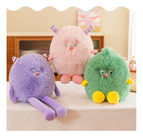 Um pequeno animal de pelúcia em forma de monstro peludo Pa Green Color