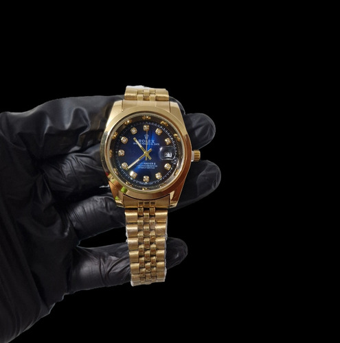 Reloj Rolex Doradoo Con Fondo Azul Clön