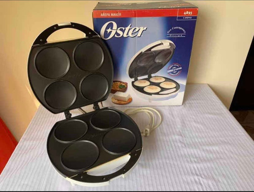 Imagen 2 de 5 de Arepera Eléctrica Oster De 4 Arepas Ayudante Cocina 575