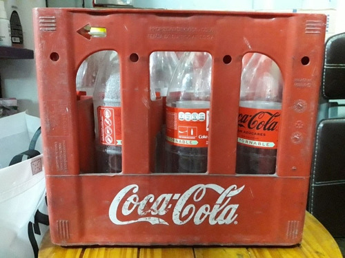 Cajón De Coca Cola Con 9 Botellas Vacías Plásticas De 2 Lt.
