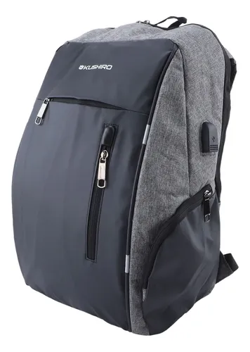 Mochila antirrobo Komplete de poliester 300D, con toma USB exterior.  Bolsillo en lateral con protección RFID.