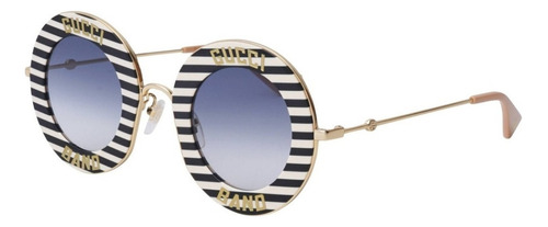 Anteojos de sol Gucci GG0113S con marco de metal color negro/blanco/dorado, lente azul de nailon degradada, varilla dorada de metal