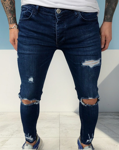 Vaqueros A La Moda Con Piernas Ajustadas Y Elásticas Rasgada